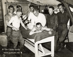 Nobby working on Vic Huxley, watched by his Australian team-mates. L to R - Jack Sharpe, Dicky Smythe, Lionel Van Pragg, Bluey Wilkinson and Max Grosskreutz